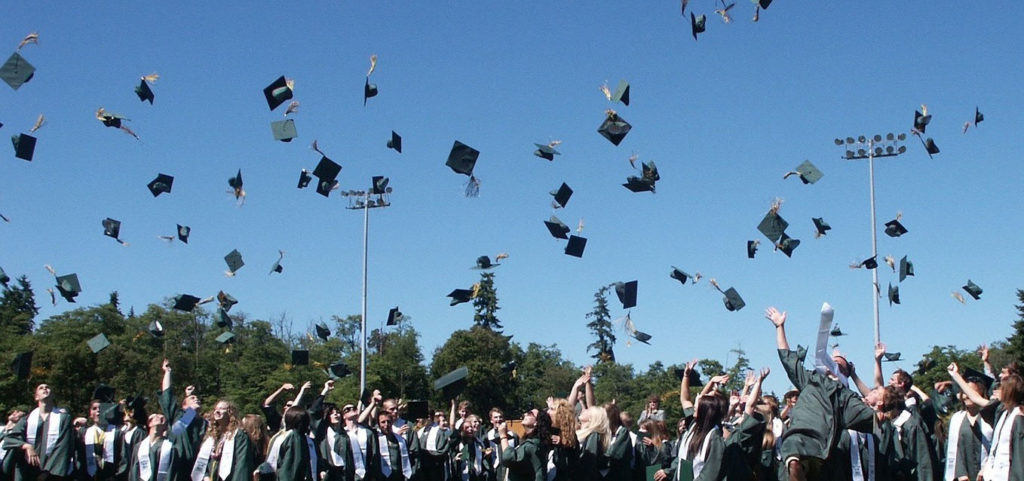 Graduation hats in the air