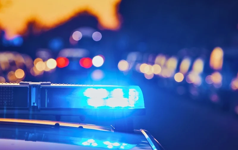 Crash Risk Increases When Police Are in Emergency Mode 1 Flashing blue emergency lights on top of a car.