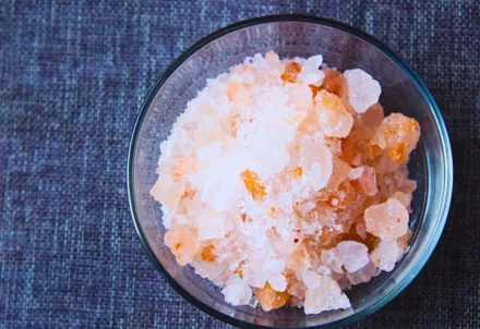 Top-down view of pink Himalayan salt in a bowl.