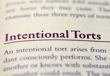 A close-up of text titled "Intentional Torts" in a textbook.