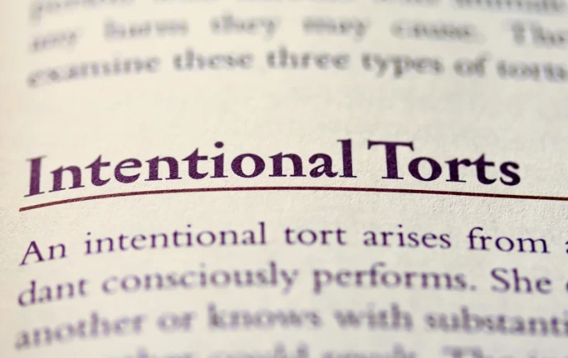 A close-up of text titled "Intentional Torts" in a textbook.