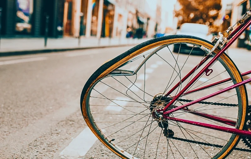 A bicycle with a severely bent and damaged wheel. Bicycle Accidents Are Increasing in Chicago